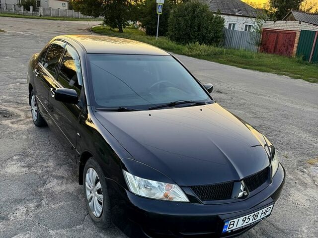 Чорний Міцубісі Lancer, об'ємом двигуна 1.6 л та пробігом 185 тис. км за 3899 $, фото 1 на Automoto.ua