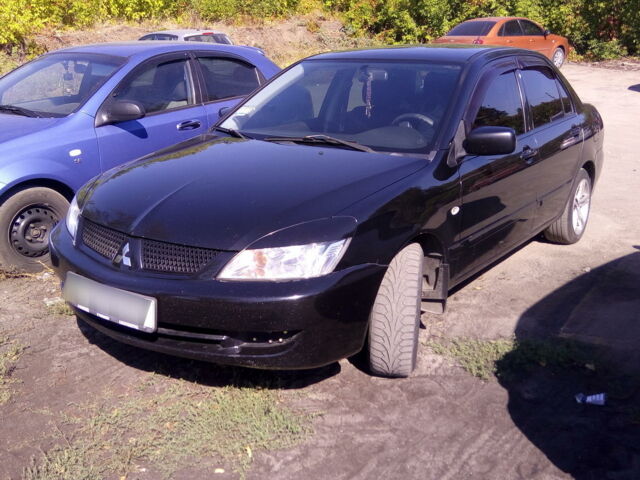 Чорний Міцубісі Lancer, об'ємом двигуна 1.6 л та пробігом 166 тис. км за 5300 $, фото 1 на Automoto.ua