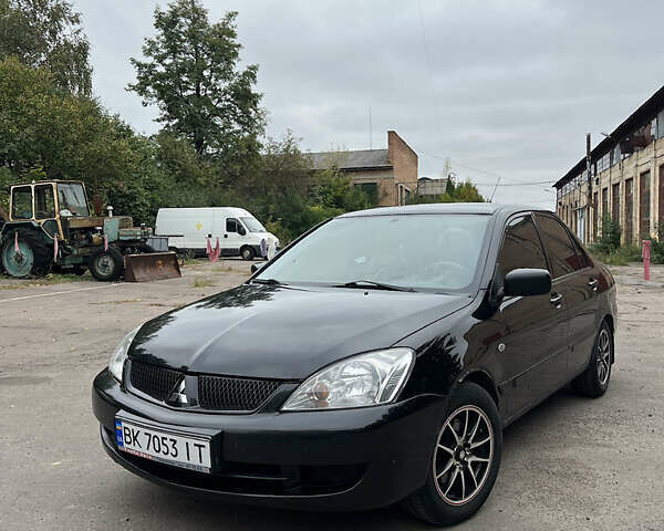 Чорний Міцубісі Lancer, об'ємом двигуна 1.58 л та пробігом 256 тис. км за 4200 $, фото 1 на Automoto.ua