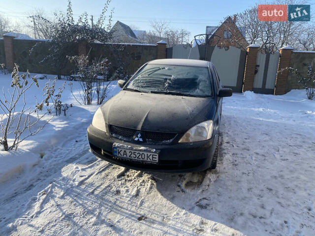 Черный Мицубиси Лансер, объемом двигателя 1.58 л и пробегом 300 тыс. км за 2700 $, фото 1 на Automoto.ua