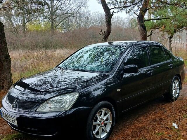 Черный Мицубиси Лансер, объемом двигателя 1.6 л и пробегом 240 тыс. км за 4700 $, фото 1 на Automoto.ua