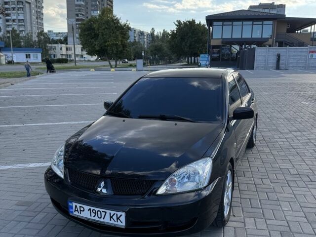 Чорний Міцубісі Lancer, об'ємом двигуна 1.6 л та пробігом 260 тис. км за 4909 $, фото 1 на Automoto.ua