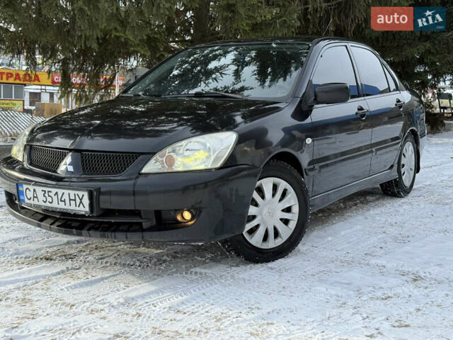 Чорний Міцубісі Lancer, об'ємом двигуна 1.6 л та пробігом 190 тис. км за 3450 $, фото 1 на Automoto.ua