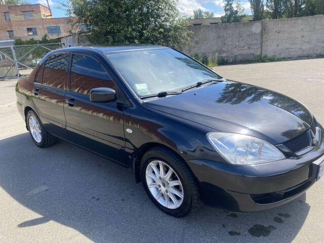 Чорний Міцубісі Lancer, об'ємом двигуна 1.6 л та пробігом 215 тис. км за 3900 $, фото 1 на Automoto.ua