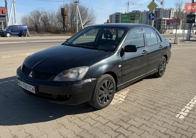 Черный Мицубиси Лансер, объемом двигателя 1.6 л и пробегом 280 тыс. км за 3200 $, фото 1 на Automoto.ua