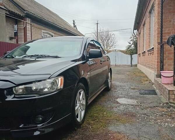 Чорний Міцубісі Lancer, об'ємом двигуна 2 л та пробігом 273 тис. км за 7100 $, фото 1 на Automoto.ua
