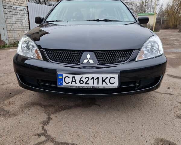 Чорний Міцубісі Lancer, об'ємом двигуна 1.6 л та пробігом 273 тис. км за 3999 $, фото 1 на Automoto.ua
