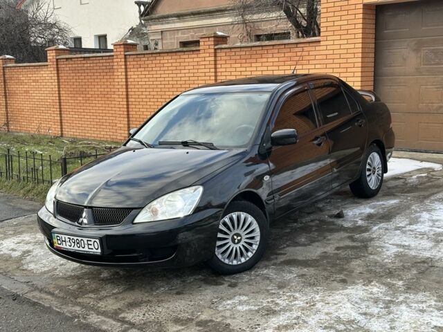 Чорний Міцубісі Lancer, об'ємом двигуна 1.6 л та пробігом 167 тис. км за 4500 $, фото 1 на Automoto.ua
