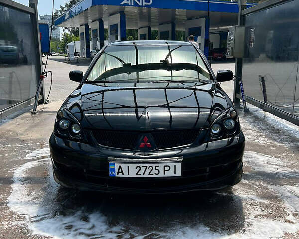Чорний Міцубісі Lancer, об'ємом двигуна 2 л та пробігом 380 тис. км за 5000 $, фото 1 на Automoto.ua