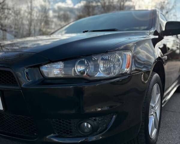 Черный Мицубиси Лансер, объемом двигателя 2 л и пробегом 224 тыс. км за 7000 $, фото 1 на Automoto.ua