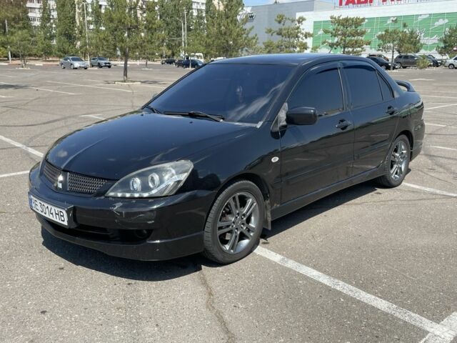 Черный Мицубиси Лансер, объемом двигателя 2 л и пробегом 258 тыс. км за 5000 $, фото 1 на Automoto.ua