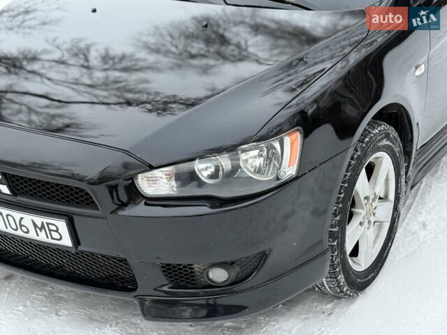 Черный Мицубиси Лансер, объемом двигателя 2 л и пробегом 180 тыс. км за 6500 $, фото 1 на Automoto.ua