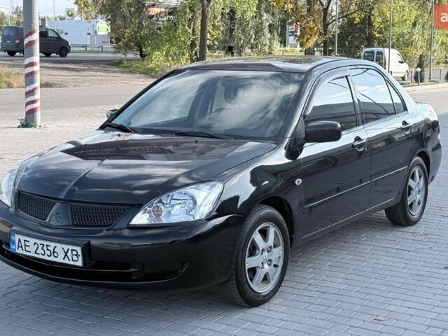 Чорний Міцубісі Lancer, об'ємом двигуна 1.58 л та пробігом 255 тис. км за 3600 $, фото 1 на Automoto.ua