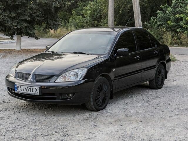 Черный Мицубиси Лансер, объемом двигателя 1.6 л и пробегом 226 тыс. км за 4800 $, фото 1 на Automoto.ua