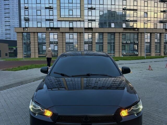 Черный Мицубиси Лансер, объемом двигателя 2 л и пробегом 242 тыс. км за 6200 $, фото 1 на Automoto.ua