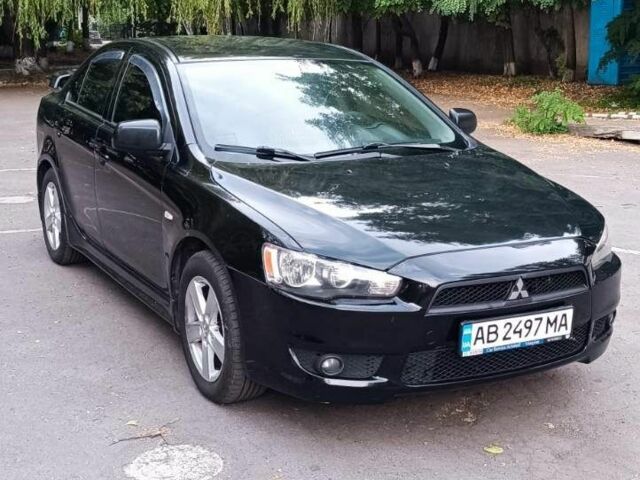 Черный Мицубиси Лансер, объемом двигателя 2 л и пробегом 210 тыс. км за 6500 $, фото 1 на Automoto.ua
