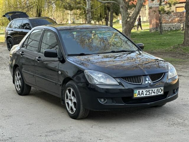 Черный Мицубиси Лансер, объемом двигателя 1.6 л и пробегом 230 тыс. км за 4300 $, фото 1 на Automoto.ua