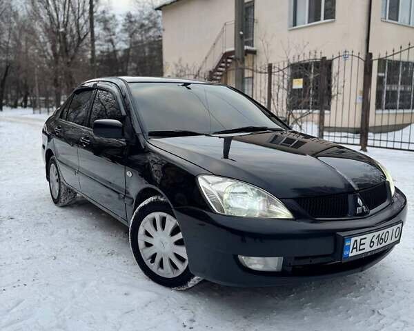 Черный Мицубиси Лансер, объемом двигателя 1.6 л и пробегом 234 тыс. км за 5000 $, фото 1 на Automoto.ua