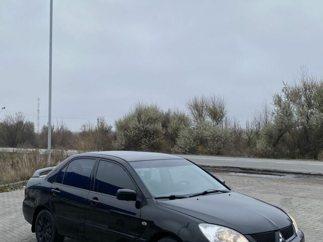 Черный Мицубиси Лансер, объемом двигателя 1.6 л и пробегом 263 тыс. км за 2900 $, фото 1 на Automoto.ua