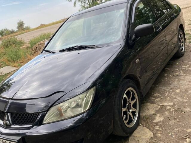 Чорний Міцубісі Lancer, об'ємом двигуна 1.6 л та пробігом 232 тис. км за 4200 $, фото 1 на Automoto.ua