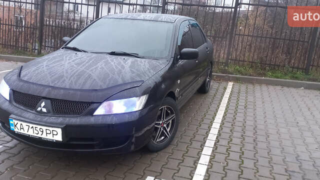 Черный Мицубиси Лансер, объемом двигателя 1.58 л и пробегом 240 тыс. км за 5600 $, фото 1 на Automoto.ua