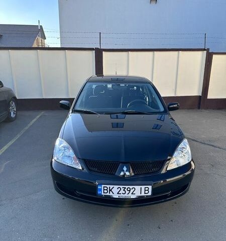 Черный Мицубиси Лансер, объемом двигателя 1.58 л и пробегом 194 тыс. км за 4950 $, фото 1 на Automoto.ua