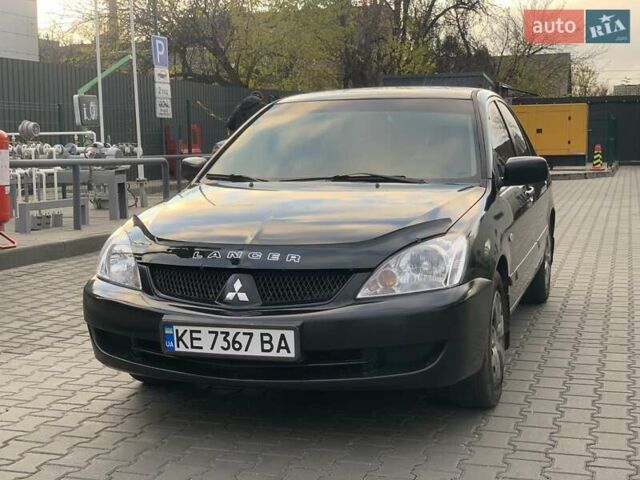 Черный Мицубиси Лансер, объемом двигателя 1.58 л и пробегом 237 тыс. км за 3850 $, фото 1 на Automoto.ua