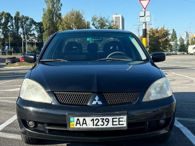 Чорний Міцубісі Lancer, об'ємом двигуна 1.6 л та пробігом 291 тис. км за 3950 $, фото 1 на Automoto.ua