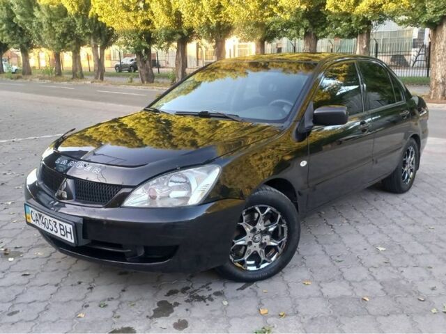Чорний Міцубісі Lancer, об'ємом двигуна 1.6 л та пробігом 245 тис. км за 4113 $, фото 1 на Automoto.ua