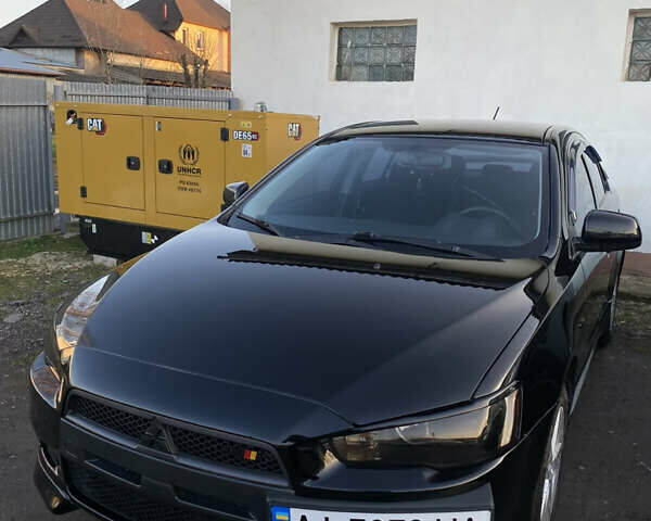 Черный Мицубиси Лансер, объемом двигателя 2 л и пробегом 164 тыс. км за 8300 $, фото 1 на Automoto.ua