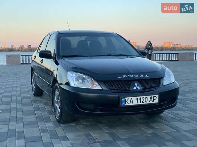Чорний Міцубісі Lancer, об'ємом двигуна 1.58 л та пробігом 237 тис. км за 4300 $, фото 1 на Automoto.ua