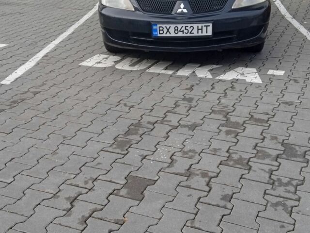 Черный Мицубиси Лансер, объемом двигателя 1.6 л и пробегом 223 тыс. км за 4300 $, фото 1 на Automoto.ua