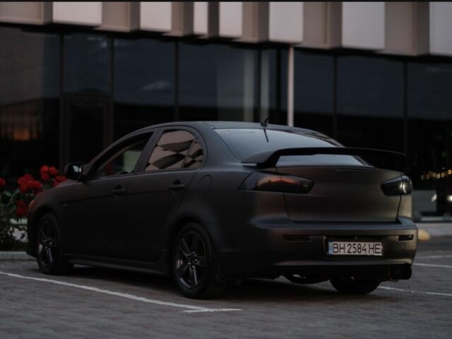 Чорний Міцубісі Lancer, об'ємом двигуна 2 л та пробігом 210 тис. км за 7002 $, фото 1 на Automoto.ua
