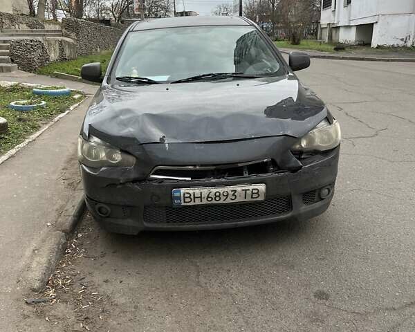 Черный Мицубиси Лансер, объемом двигателя 2 л и пробегом 220 тыс. км за 5500 $, фото 1 на Automoto.ua