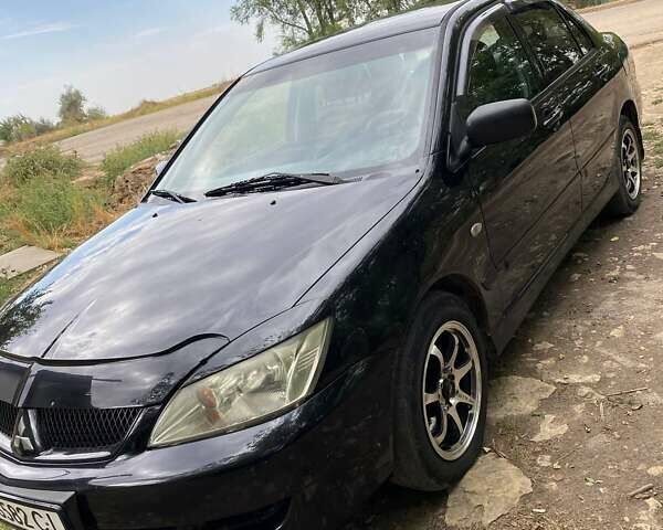Чорний Міцубісі Lancer, об'ємом двигуна 1.58 л та пробігом 231 тис. км за 4300 $, фото 1 на Automoto.ua