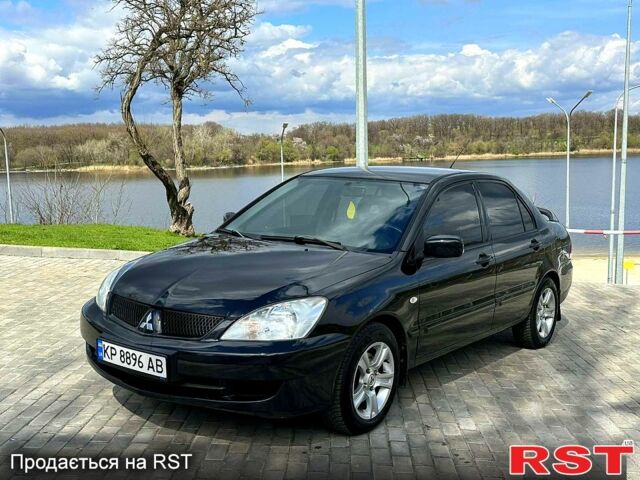 Черный Мицубиси Лансер, объемом двигателя 1.6 л и пробегом 270 тыс. км за 4499 $, фото 1 на Automoto.ua