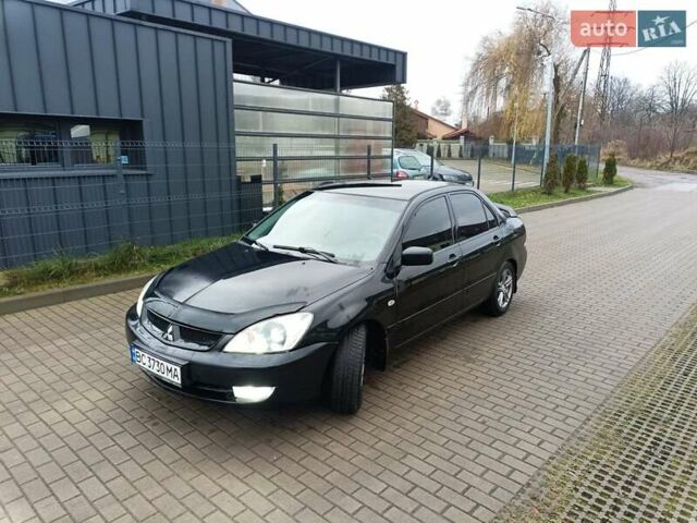 Черный Мицубиси Лансер, объемом двигателя 1.6 л и пробегом 144 тыс. км за 4200 $, фото 1 на Automoto.ua
