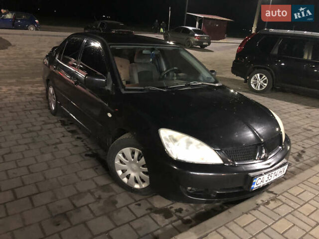 Чорний Міцубісі Lancer, об'ємом двигуна 1.6 л та пробігом 280 тис. км за 3800 $, фото 1 на Automoto.ua