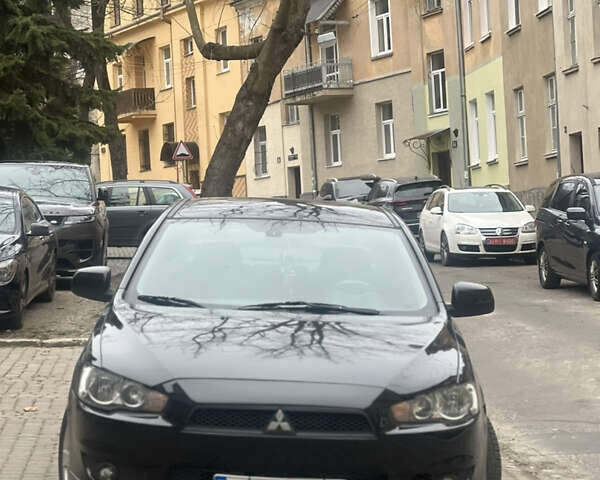 Черный Мицубиси Лансер, объемом двигателя 2 л и пробегом 333 тыс. км за 7300 $, фото 1 на Automoto.ua