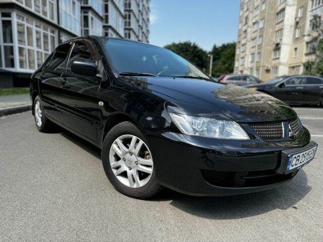 Черный Мицубиси Лансер, объемом двигателя 1.6 л и пробегом 177 тыс. км за 4500 $, фото 1 на Automoto.ua