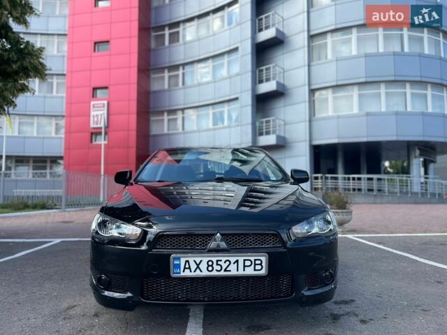 Чорний Міцубісі Lancer, об'ємом двигуна 2 л та пробігом 220 тис. км за 5599 $, фото 1 на Automoto.ua