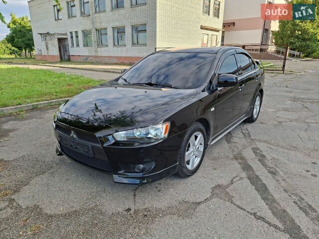 Чорний Міцубісі Lancer, об'ємом двигуна 2 л та пробігом 173 тис. км за 8800 $, фото 1 на Automoto.ua