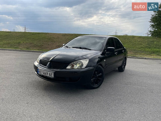 Чорний Міцубісі Lancer, об'ємом двигуна 1.58 л та пробігом 269 тис. км за 4500 $, фото 1 на Automoto.ua