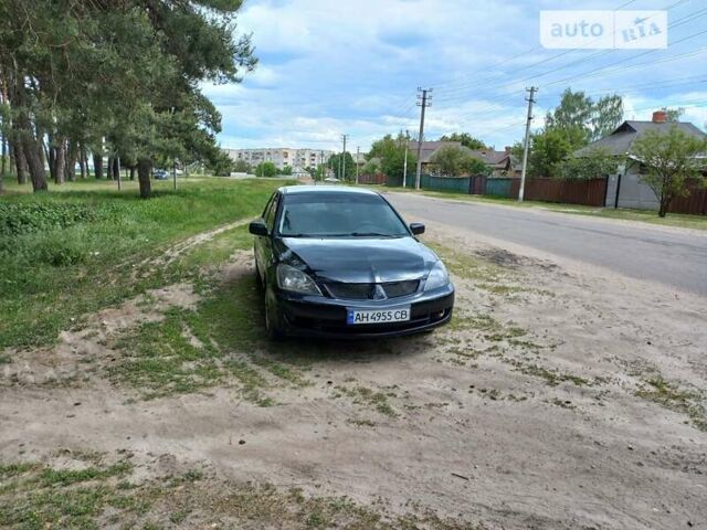 Черный Мицубиси Лансер, объемом двигателя 1.58 л и пробегом 204 тыс. км за 3850 $, фото 1 на Automoto.ua