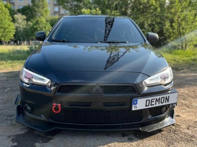 Чорний Міцубісі Lancer, об'ємом двигуна 2 л та пробігом 226 тис. км за 6700 $, фото 1 на Automoto.ua