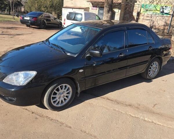 Чорний Міцубісі Lancer, об'ємом двигуна 1.6 л та пробігом 201 тис. км за 3950 $, фото 1 на Automoto.ua