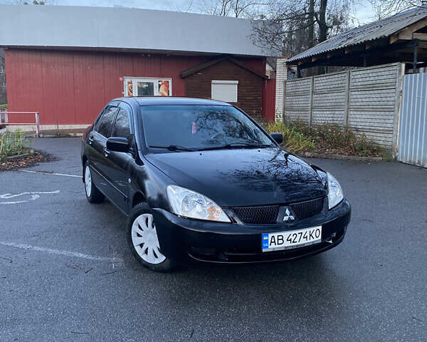 Чорний Міцубісі Lancer, об'ємом двигуна 1.58 л та пробігом 280 тис. км за 3650 $, фото 1 на Automoto.ua