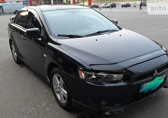 Чорний Міцубісі Lancer, об'ємом двигуна 2 л та пробігом 116 тис. км за 7900 $, фото 1 на Automoto.ua