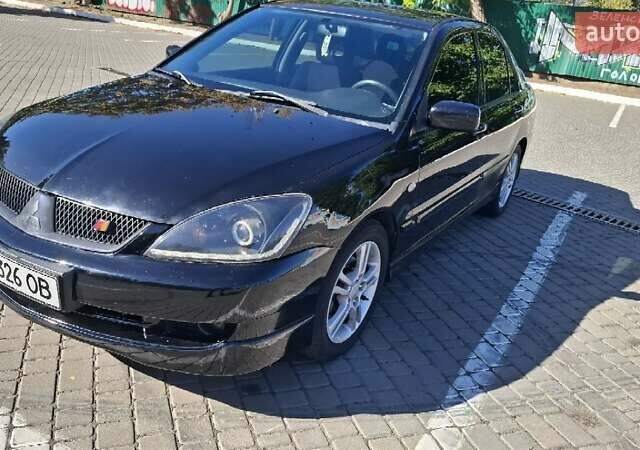 Чорний Міцубісі Lancer, об'ємом двигуна 2 л та пробігом 174 тис. км за 4800 $, фото 1 на Automoto.ua