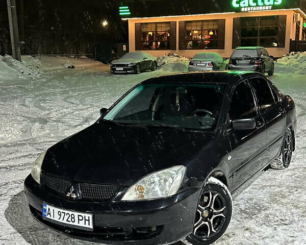 Чорний Міцубісі Lancer, об'ємом двигуна 1.58 л та пробігом 268 тис. км за 3950 $, фото 1 на Automoto.ua